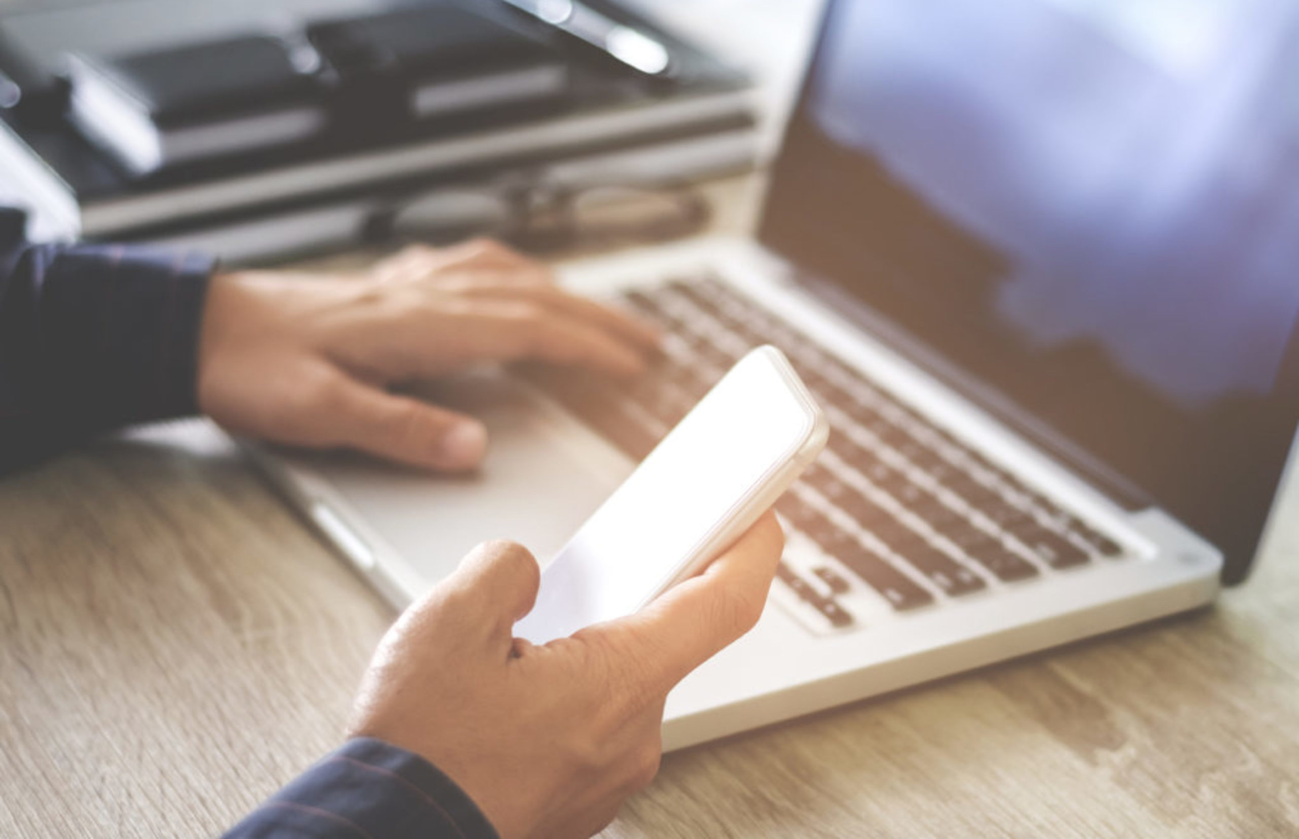 man using mobile smartphone shopping online with laptop, payment and marketing concept
