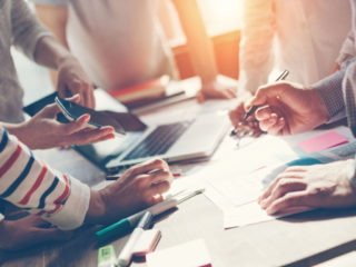 Team work process. Marketing strategy brainstorming. Paperwork a