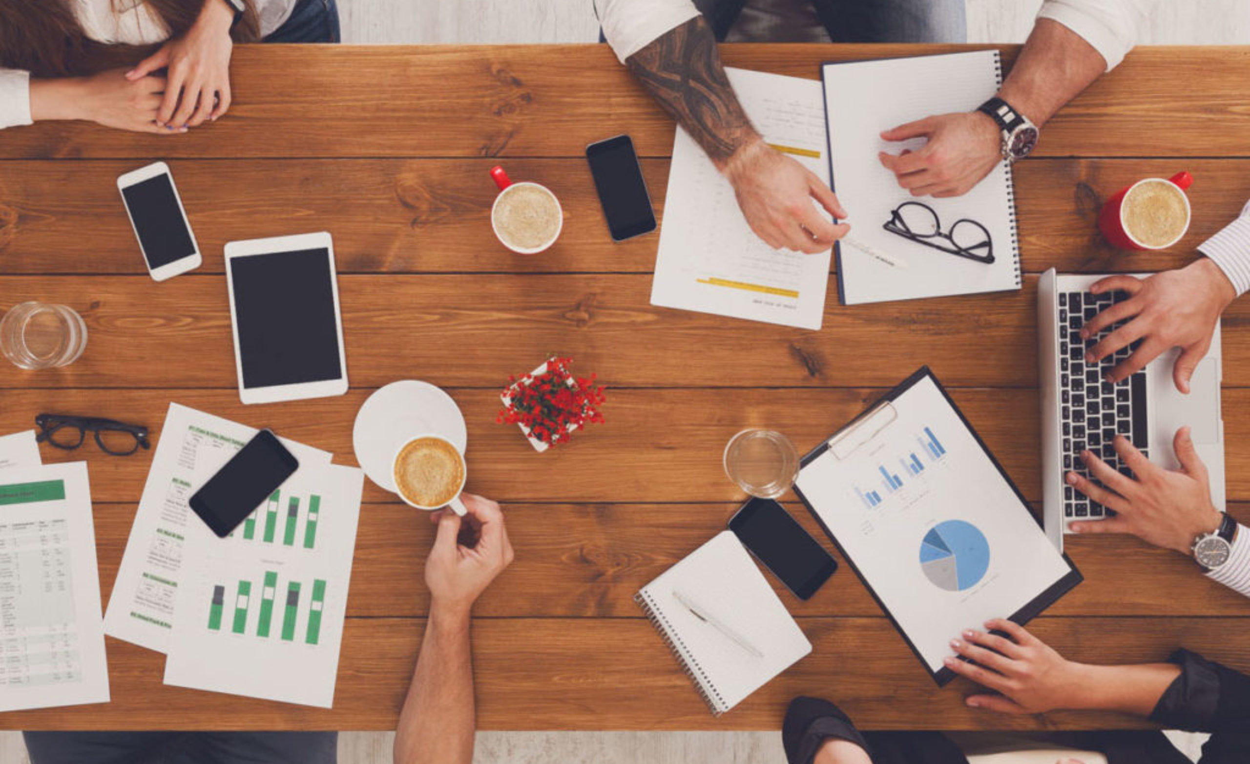 Group of busy business people working in office, top view