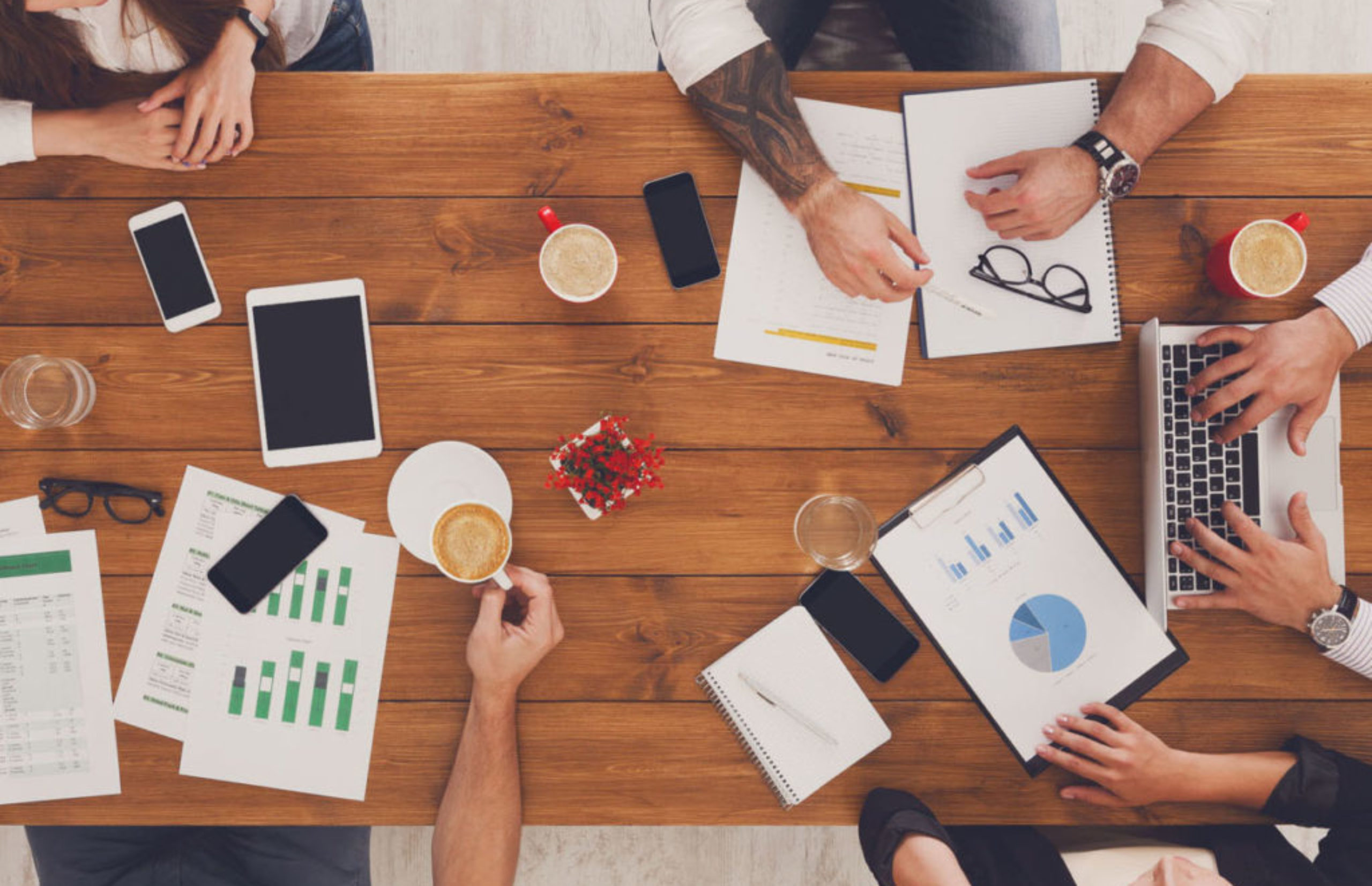 Group of busy business people working in office, top view
